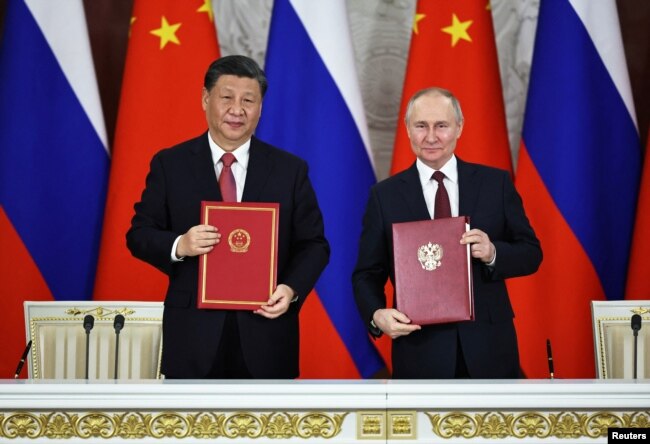 习近平与普京在克里姆林宫签署中俄协议。(2023年3月21日)