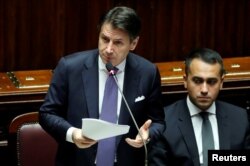 FILE - Italian Prime Minister Giuseppe Conte presents his government's program as 5-Star Movement leader Luigi di Maio sits next to him, ahead of confidence vote at the Parliament in Rome, Sept. 9, 2019.