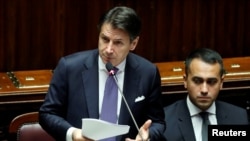 Italian Prime Minister Giuseppe Conte presents his government's programme as 5-Star Movement leader Luigi di Maio sits next to him, ahead of confidence vote at the Parliament in Rome, Italy, Sept. 9, 2019. 
