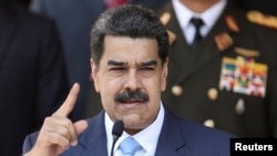 Venezuela's President Nicolas Maduro speaks during a news conference at Miraflores Palace in Caracas, March 12, 2020.