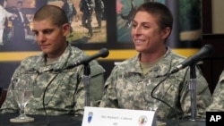 U.S. Army Army 1st Lt. Shaye Haver, right, speaks with reporters, Thursday, Aug. 20, 2015.