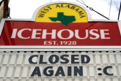A sign outside the West Alabama Icehouse shows the bar is closed, in Houston, June 29, 2020.