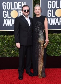 Ricky Gervais, left, and Jane Fallon arrive at the 77th annual Golden Globe Awards at the Beverly Hilton Hotel on Sunday, Jan. 5, 2020, in Beverly Hills, Calif.