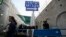 A sign pointing to the men's exit is seen at Rachel's Tomb in the West Bank town of Bethlehem November 8, 2011.