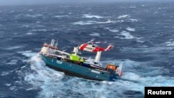 Crew members onboard Dutch cargo ship Eemslift Hendrika is evacuated in stormy weather off the coast of Norway in the North Sea, April 5, 2021 in this still image obtained from social media video. (Joint Rescue and Coordination Centre (JRCC) South-Norway)