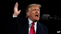 President Donald Trump speaks at a campaign rally for Senate Republican candidates, Sen. Kelly Loeffler, R-Ga., and Sen. David Perdue, R-Ga., at Valdosta Regional Airport, Saturday, Dec. 5, 2020, in Valdosta, Ga. (AP Photo/Evan Vucci)