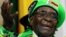 Zimbabwean President Robert Mugabe addresses a meeting of his ruling ZANU PF party's youth league in Harare, Zimbabwe, Oct. 7, 2017. 