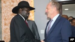 FILE - South Sudan's President Salva Kiir, left, shakes hands with UN chief David Shearer during meetings with the UN Security Council on Oct. 20, 2019, about the status of the country's peace deal.