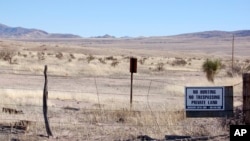 FILE- This Jan. 20, 2012, photo, taken in New Mexico's Bootheel region shows part of the Diamond A Ranch and is 77 miles from the nearest border patrol station. A Guatemalan girl, 7, died after her father and other migrants were picked up along the remote stretch of the border.