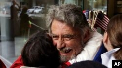 Defendant Neil Wampler is greeted by supporters as he leaves federal court in Portland, Ore., Oct. 27, 2016. A jury exonerated brothers Ammon and Ryan Bundy and five others of conspiring to impede federal workers from their jobs at the Malheur National Wildlife Refuge.