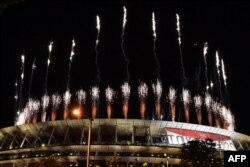 Fireworks go off around the Olympic Stadium during the closing ceremony of the Tokyo 2020 Olympic Games, as seen from outside the venue in Tokyo on Aug. 8, 2021. (Photo by Kazuhiro NOGI / AFP)