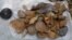 Surface-collected stone artifacts that were found lying scattered on the gravelly surface near Talepu on the Indonesian island of Sulawesi, are pictured in this undated handout photo, Jan. 13, 2016. 