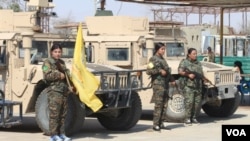 Female members of the Syrian Democratic Forces are shown in this undated file photo.