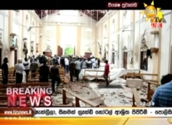 FILE - This image made from video provided by Hiru TV shows damage inside St. Anthony's Shrine after a blast in Colombo, April 21, 2019. Near simultaneous blasts rocked three churches and three hotels in Sri Lanka on Easter.