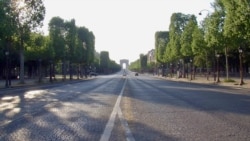 A nearly empty Champs Elysees avenue is seen in central Paris, France. (Lisa Bryant/VOA)