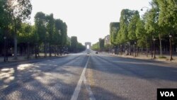 A nearly empty Champs Elysees avenue is seen in central Paris, France. (Lisa Bryant/VOA)