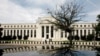 FILE PHOTO: The Federal Reserve building is reflected on a car in Washington