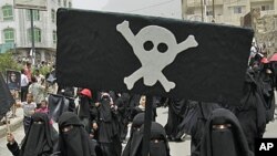 Women march during a demonstration in the southern city of Taiz demanding the ouster of Yemen's President Ali Abdullah Saleh, July 17, 2011
