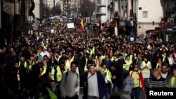 Protesters take part in a demonstration of the "yellow vest" movement in Paris, Feb. 16, 2019.