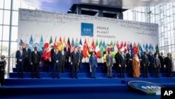 U.S. President Joe Biden, bottom left, poses with other leaders for a group photo of the G-20 Summit at the La Nuvola conference center, in Rome, Italy, Oct. 30, 2021.