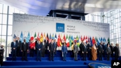 U.S. President Joe Biden, bottom left, poses with other leaders for a group photo of the G-20 Summit at the La Nuvola conference center, in Rome, Italy, Oct. 30, 2021.