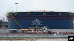 FILE — Oil installations at the Dangote refinery during the opening ceremony in Lagos, Nigeria, May 22, 2023. 