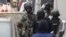 Belgian police stage a raid, in search of suspected muslim fundamentalists linked to the deadly attacks in Paris, in the Brussels suburb of Molenbeek, Nov.16, 2015