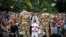 FILE - Ethiopian soldiers try to stop protesters in Bishoftu, in the Oromia region of Ethiopia, Oct. 2, 2016.