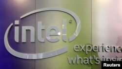 FILE - Shadows are cast near an Intel logo at an exhibition in Taipei, Taiwan, June 2, 2015. 