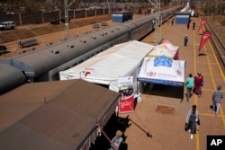 The Phelophepa train, is stationed at a station in Tembisa, east of Johannesburg, South Africa, Thursday, Aug. 22, 2024. (AP Photo/Themba Hadebe)