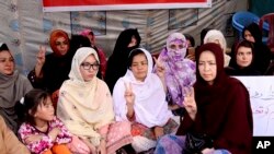 FILE - Pakistani lawyer Jalila Haider, center, from the Hazara Shi'ite minority community participates in a hunger strike with others at a camp in Quetta, Apr. 30, 2018. 