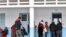 Voters queue outside a polling station during the 2023 local elections in the locality of Mnihla in Ariana province on the outskirts of Tunis on December 24, 2023.