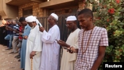 Residents and displaced people try to access the internet via Starlink in the city of Omdurman, on March 9, 2024
