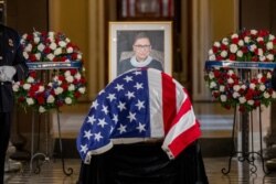 FILE - Justice Ruth Bader Ginsburg lies in state in Statuary Hall of the U.S. Capitol in Washington, Sept. 25, 2020.