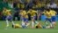 Brazil's players react as Neymar scores the decisive penalty kick during the final match of the men's Olympic soccer tournament at Maracana Stadium in Rio de Janeiro, Brazil, Aug. 20, 2016.