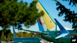 FILE - Unpainted Boeing 737 Max aircraft sit at the company's facilities in Renton, Washington, on Sept. 24, 2024. The International Association of Machinists and Aerospace Workers said on Oct. 19 that striking members plan to hold a ratification vote on a new contract proposal.