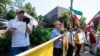 FILE - Iranian Americans opposed to Iran's Islamist rulers protest in front of the Comfort Inn Sandy Springs - Perimeter hotel, which Iran used as a polling station for its citizens who wanted to vote in its presidential election, June 18, 2021.
