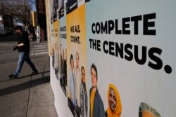 Signs advertising the 2020 U.S. Census cover a closed and boarded-up business amid the coronavirus disease (COVID-19) outbreak in Seattle, Washington, U.S., March 23, 2020.