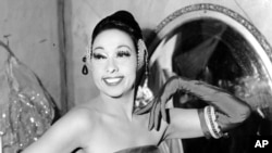FILE - In this file photo dated March 6, 1961, singer Josephine Baker poses in her dressing room at the Strand Theater in New York City, USA. The remains of American-born singer and dancer Josephine Baker will be reinterred at the Pantheon monument in Paris.