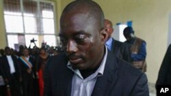 Congolese president Joseph Kabila casts his ballot in the country's presidential election at a polling station in Kinshasa, Democratic Republic of Congo, Monday Nov. 28, 2011. Voting began Monday with delays and setbacks in this massive nation pummeled by