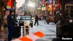 FILE - Law enforcement members work at the site where people were killed by a man driving a truck in an attack during New Year's celebrations, in New Orleans, Louisiana, Jan. 2, 2025.