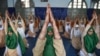 Indian students from Anjuman-E-Islam school participate in a Yoga rehearsal ahead of World Yoga Day in Ahmedabad.