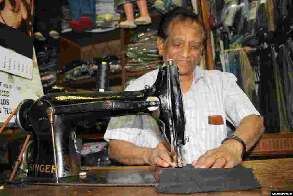 Chiman Chhiba carries on a family tailoring business founded by his father a century ago in central Johannesburg. Photo by Darren Taylor