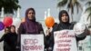 FILE - Indonesian mothers protest child sexual abuse in Banda Aceh in Aceh province, on western Sumatra island, April 24, 2014, following incidents of child sexual abuse in Banda Aceh and in Jakarta.