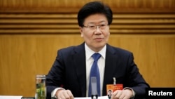 Xinjiang Communist Party Secretary Zhang Chunxian answers a question during the Xinjiang delegation's group meeting at the annual session of the National People's Congress (NPC), the country's parliament, in Beijing, March 10, 2015. 