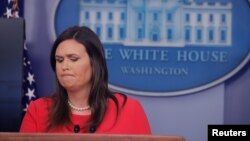 FILE - White House press secretary Sarah Sanders addresses reporters during a briefing in Washington, Jan. 28, 2019.