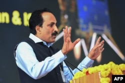 S. Somanath, chairman of the Indian Space Research Organisation (ISRO) addresses an event at the ISRO Telemetry Tracking and Command Network (ISTRAC) center in Bengaluru on August 23, 2023, after the successful lunar landing. (Photo by Mohan KUMAR / AFP)