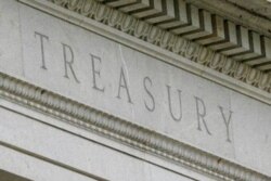 FILE - This May 4, 2021 file photo shows the Treasury Building in Washington.