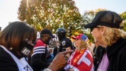 Supporters of U.S. president Donald Trump argue with supporters of President-elect Joe Biden in front of the White House in Washington, D.C., on November 13, 2020.