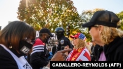 U.S. – Supporters of U.S. president Donald Trump argue with supporters of President-elect Joe Biden in front of the White House in Washington, D.C., on November 13, 2020.